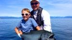 Father and son pose with a fresh catch while on a fishing charter at Pacific Playgrounds Resort and Marina